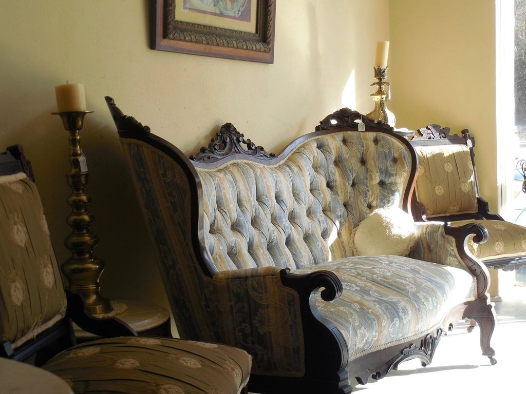A guest room with a large bed and soft lighting
