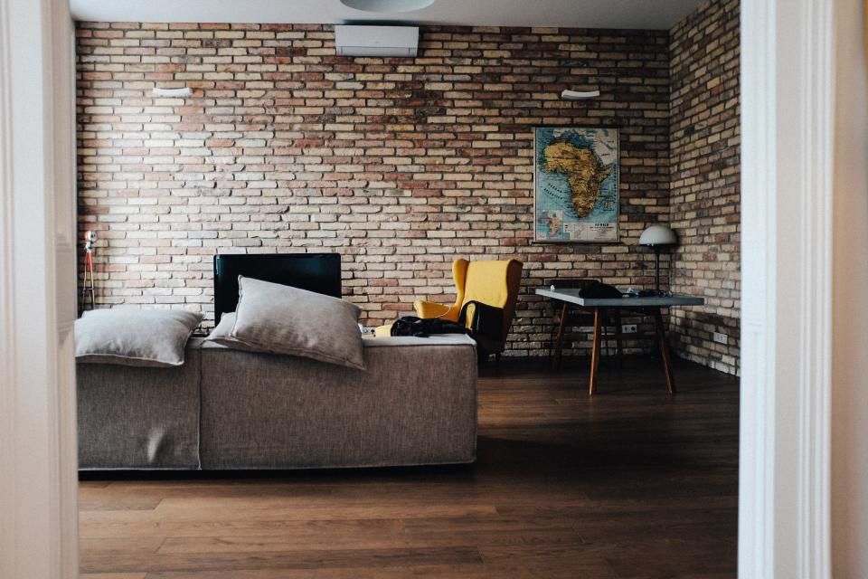 A suite sitting room with a sofa and armchairs